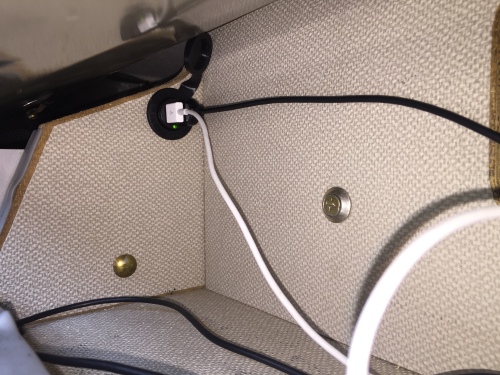 New dual USB charging port in the upper cabinet behind the AC unit.